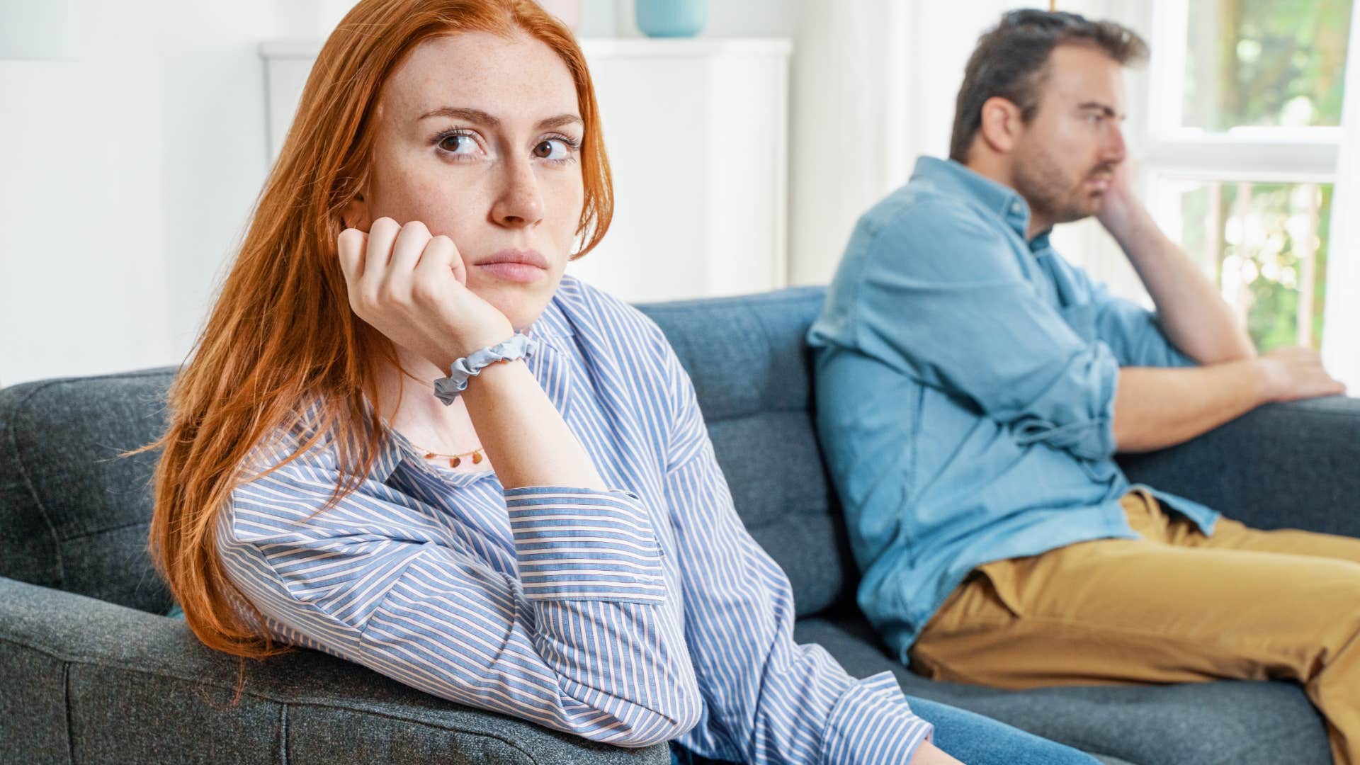 unhappy woman turned away from partner