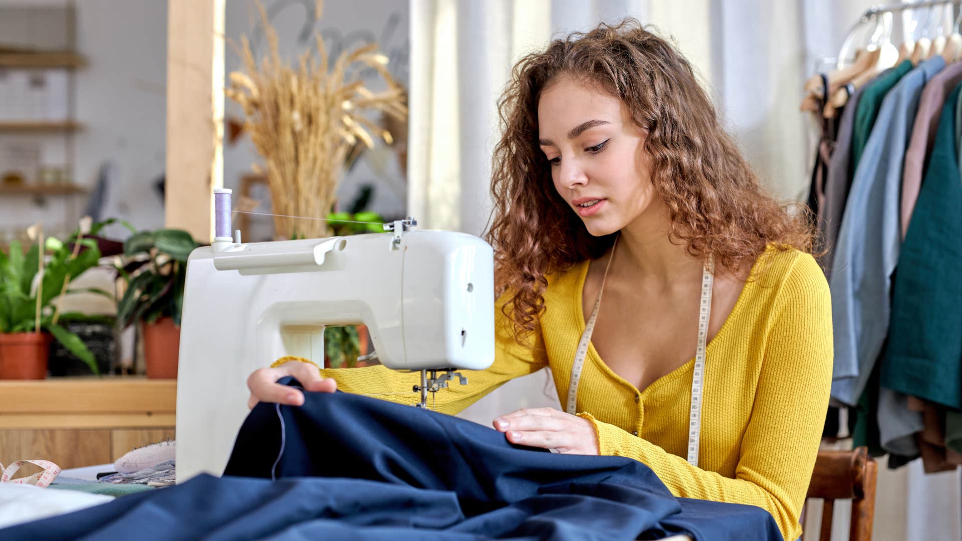 woman in yellow shirt doing arts and crafts while she sews