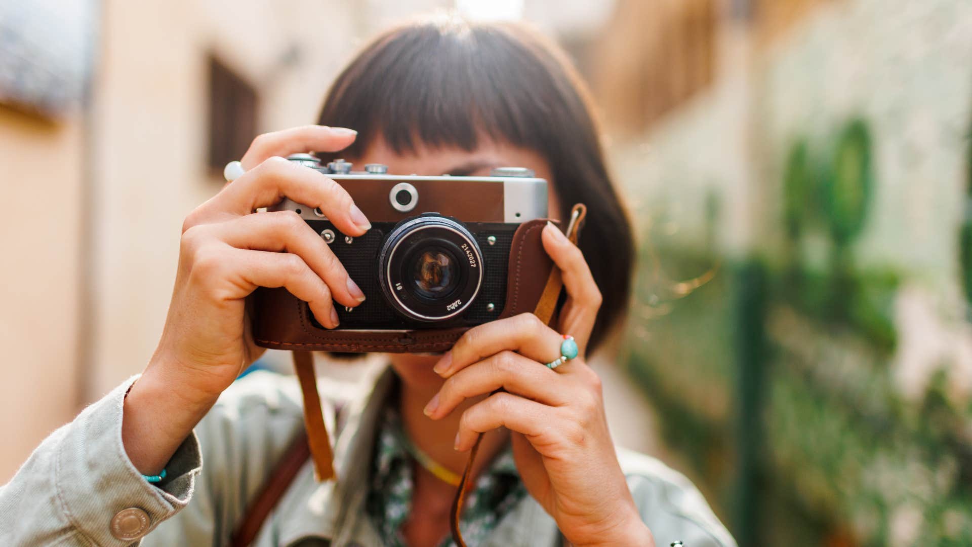 woman with camera doing photography