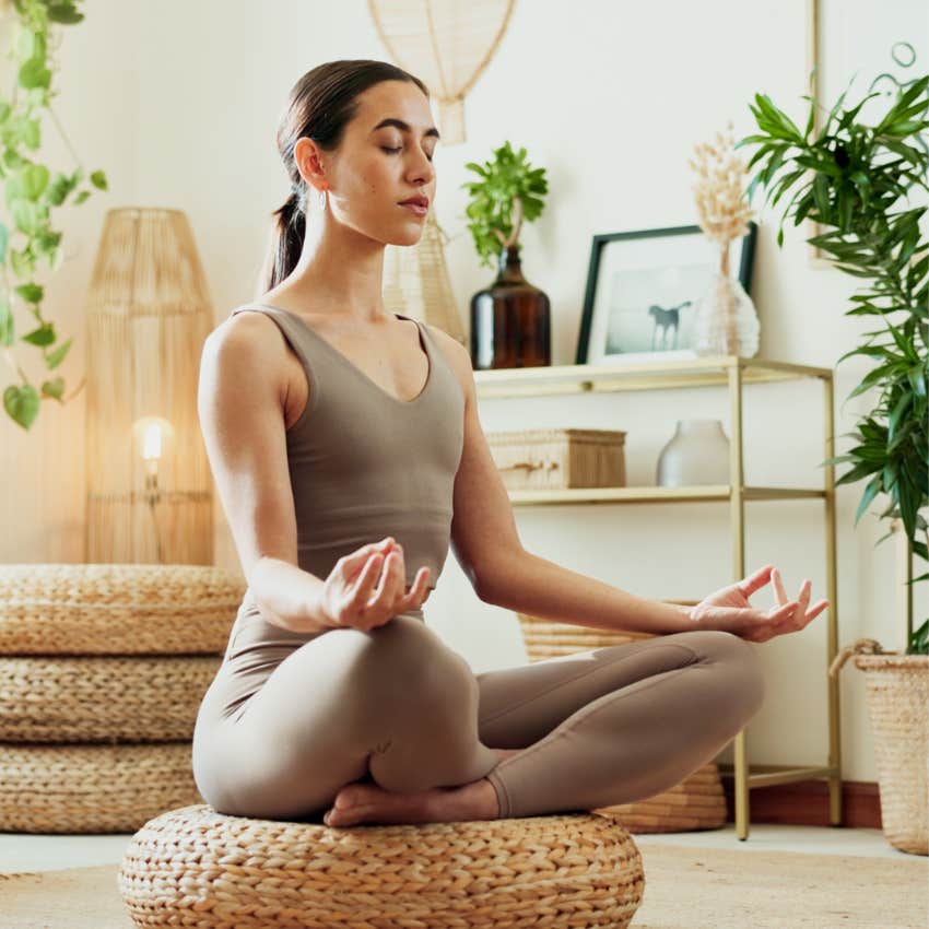 woman doing meditation to trick her greedy brain
