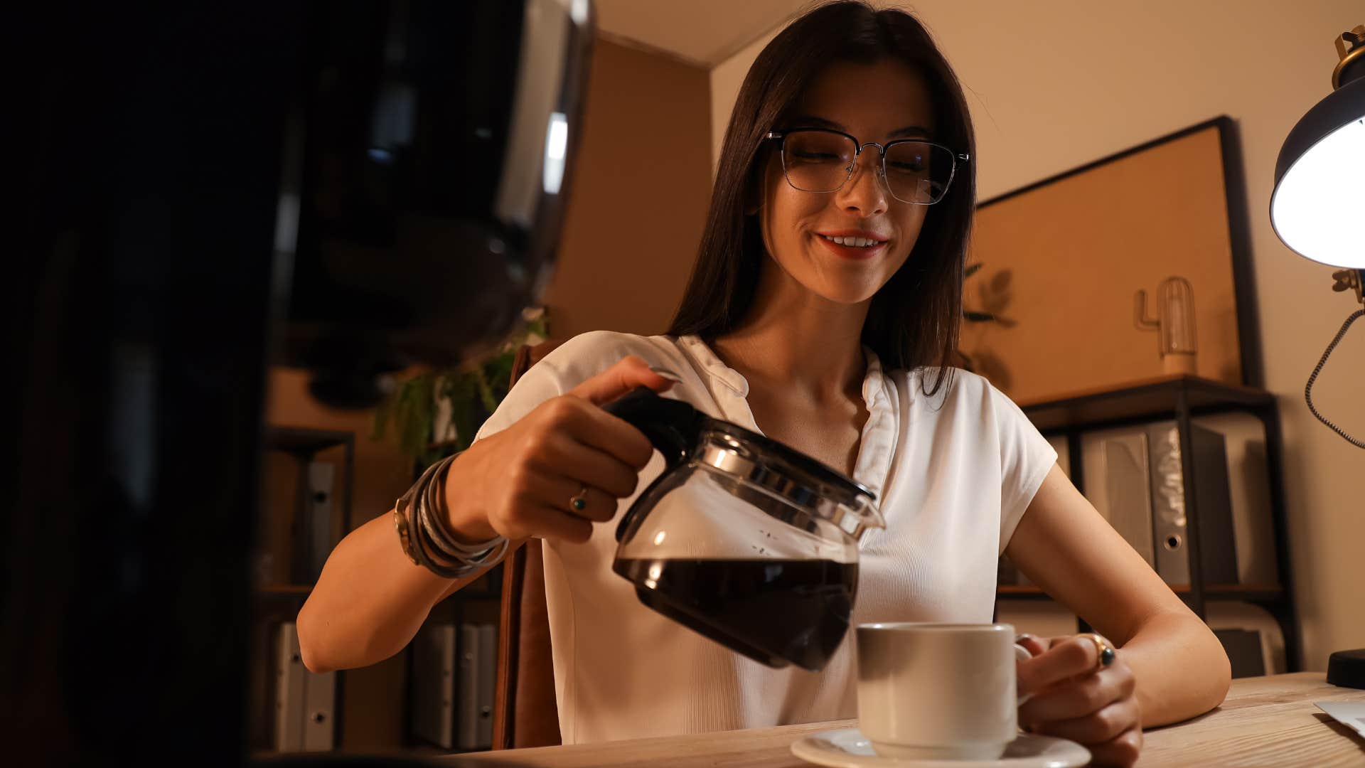 woman pouring coffee from simple coffee maker