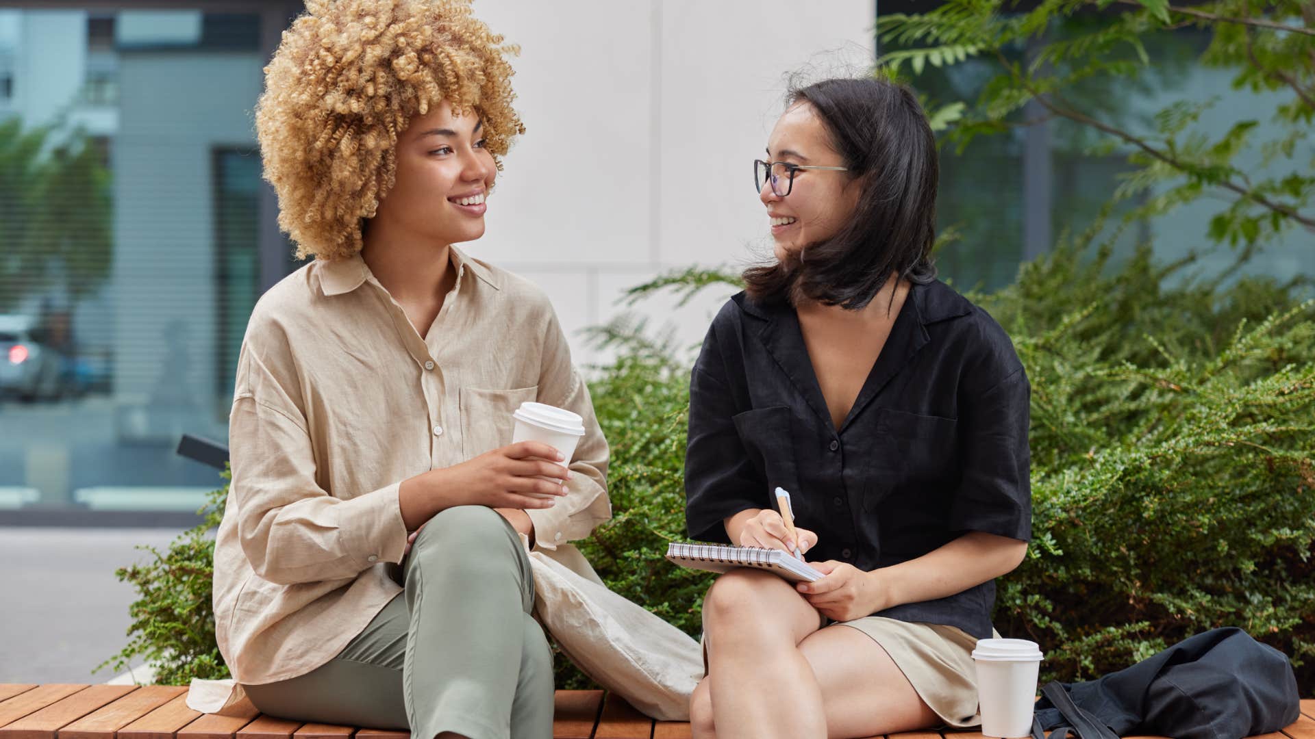 happy woman interested in what friend has to say