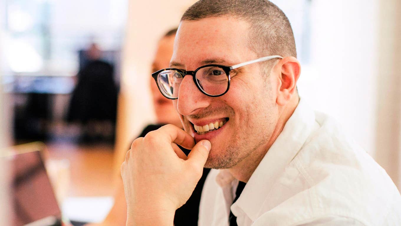 Interview Questions That Actually Get To The Core Of Whether A Person Has A Work Ethic Or Not Man asking questions during interview.