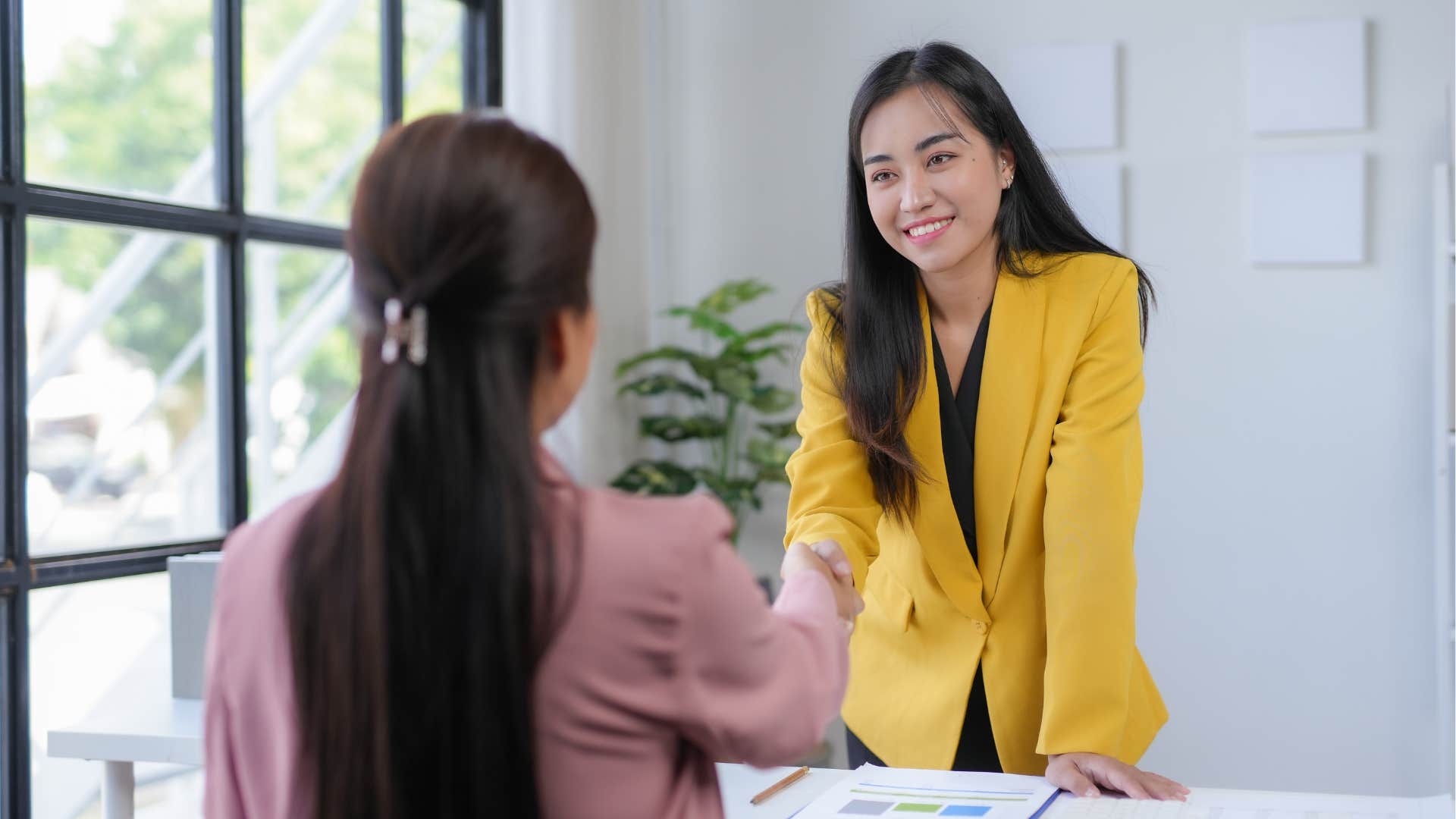 woman asking the interview question what about the company stands out