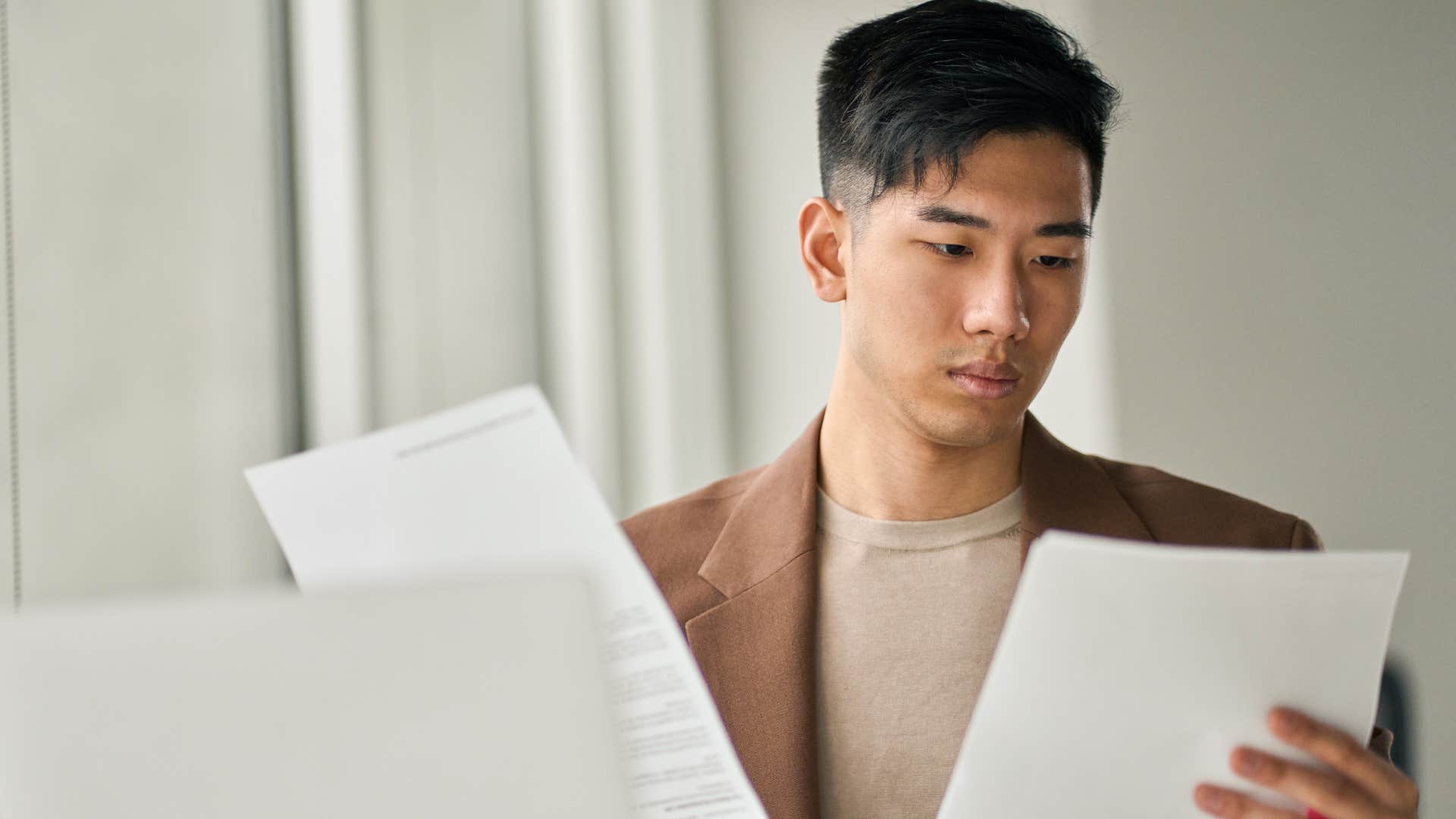 man with strong financial literacy paying bills