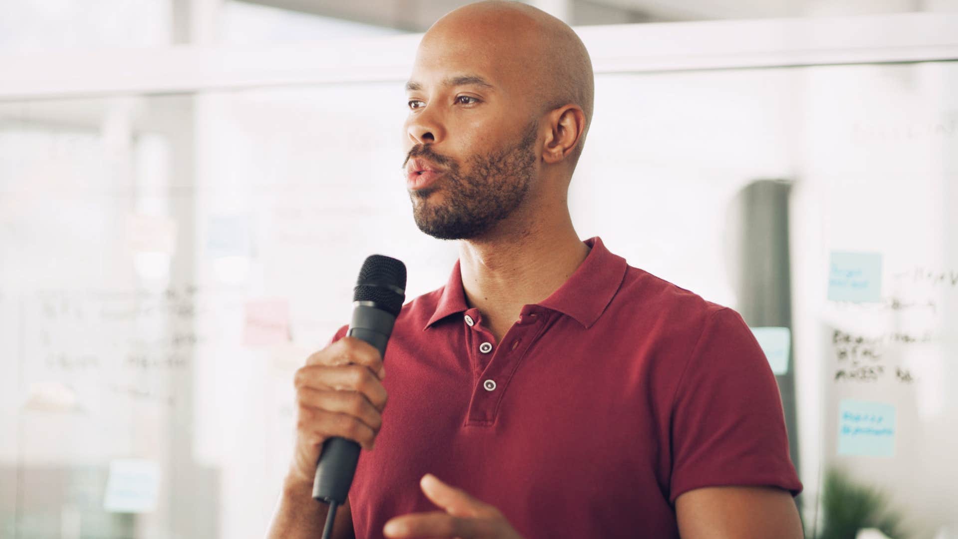 wealthy man doing public speaking at work