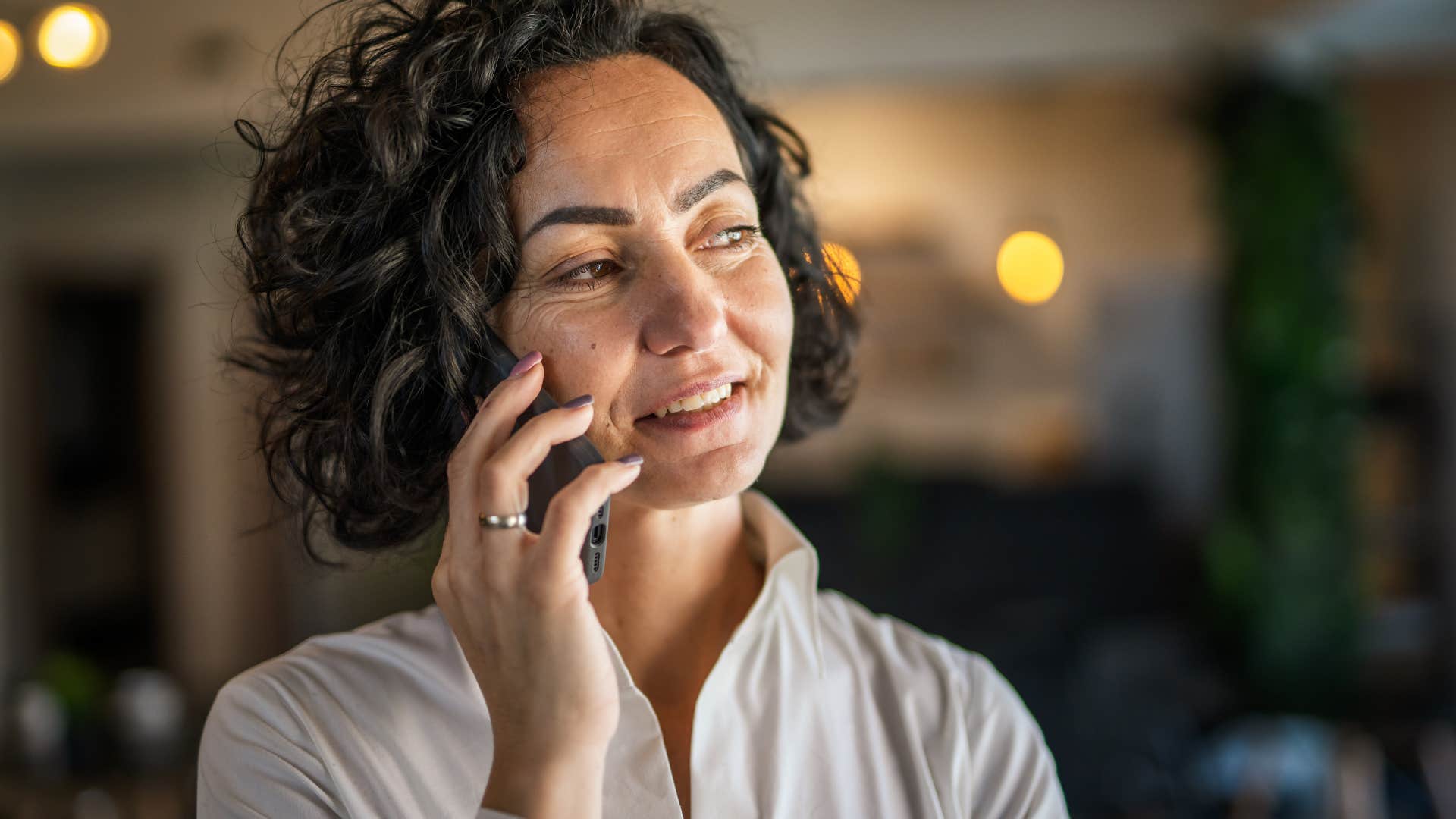 woman with social awareness talking on the phone