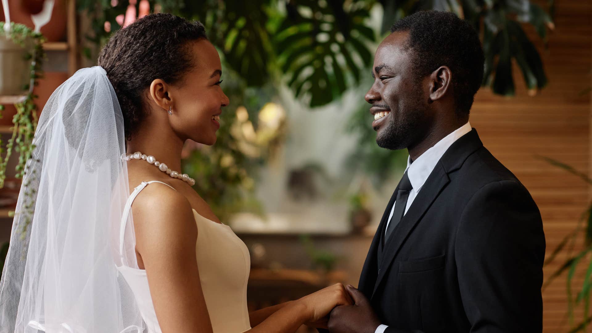woman in wedding dress getting married on a timeline as she smiles at groom