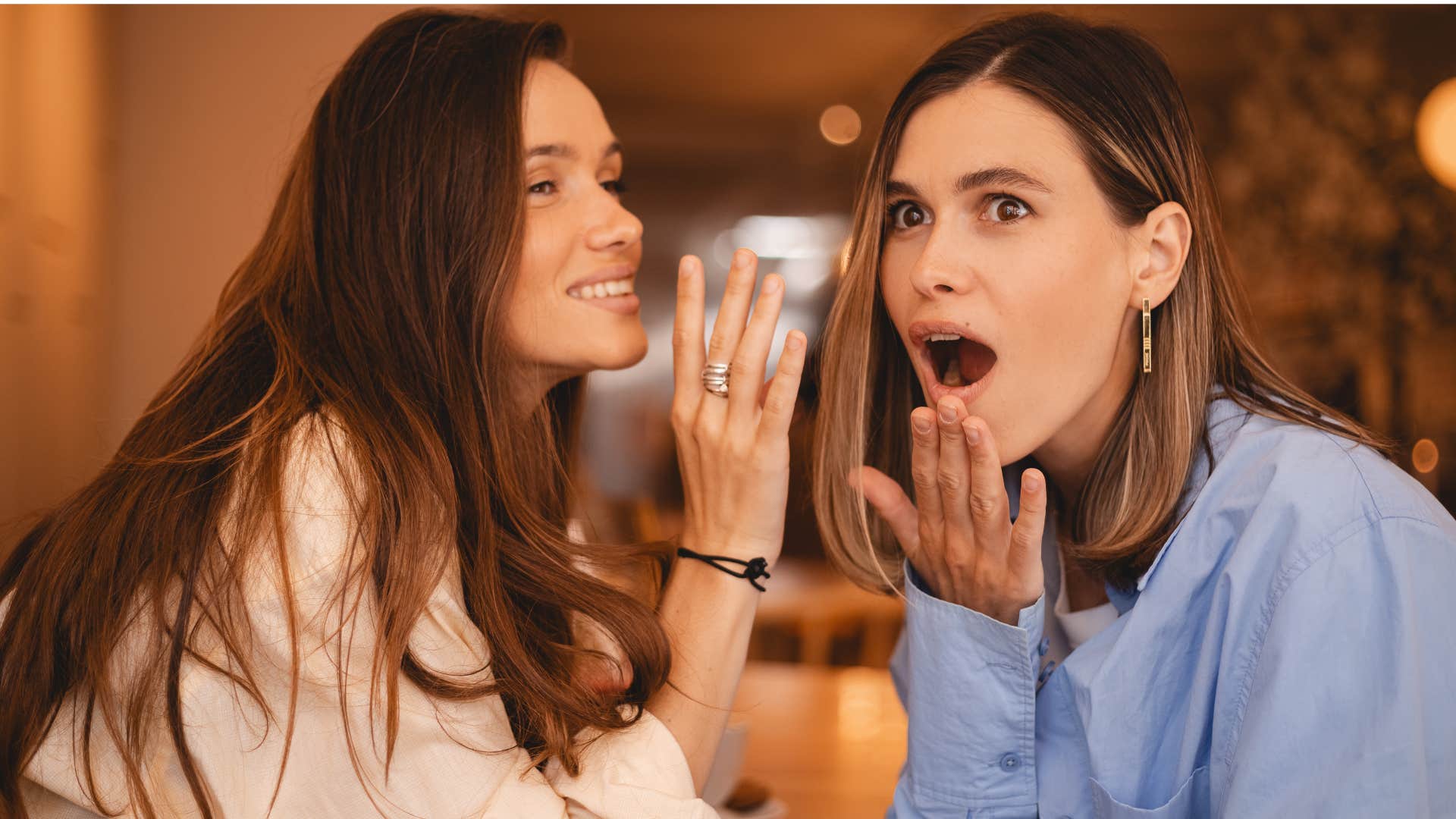 two women gossiping and causing drama as woman in blue looks shocked at news