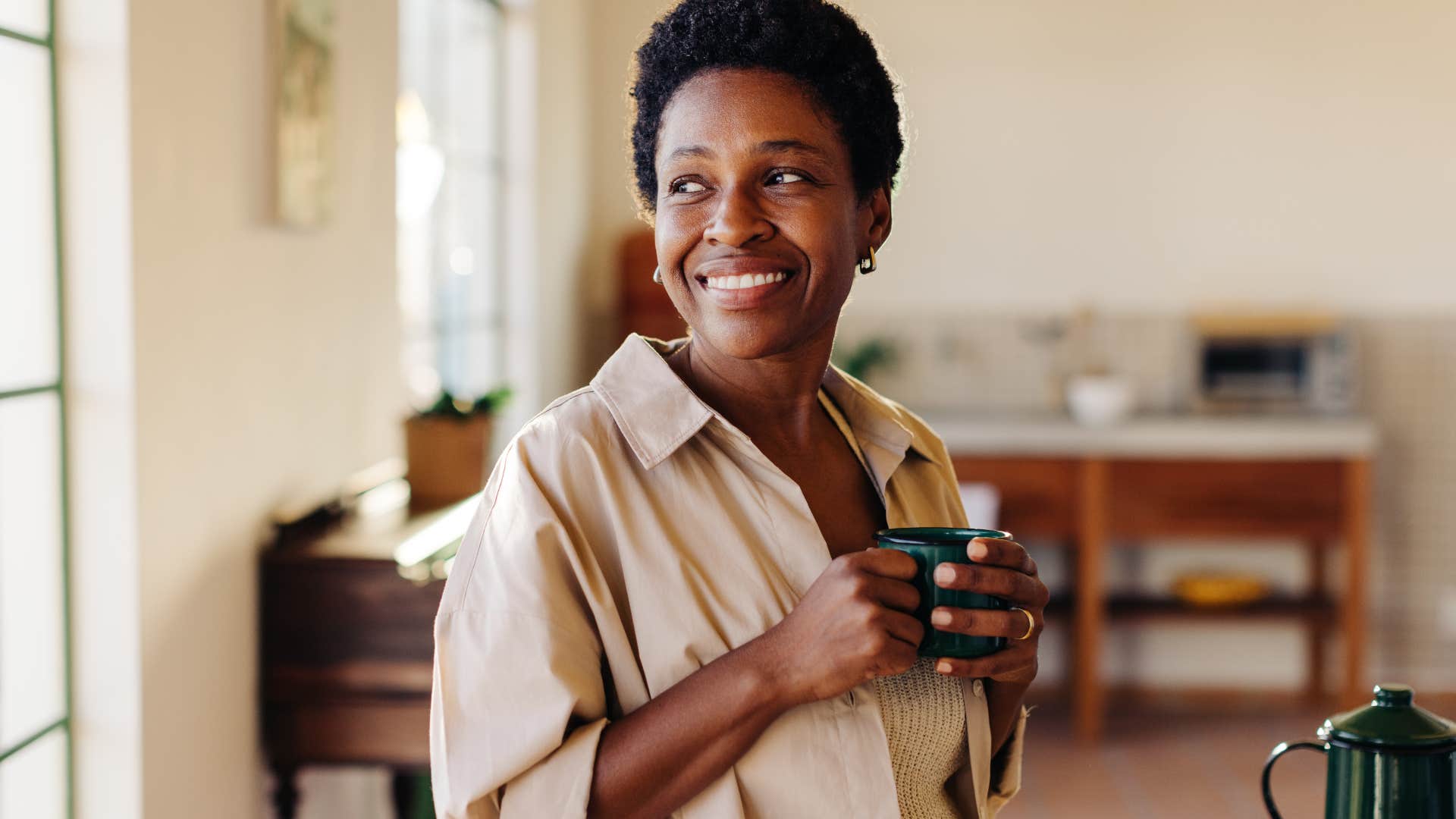 Woman crafting meals around leftovers in her kitchen at home.