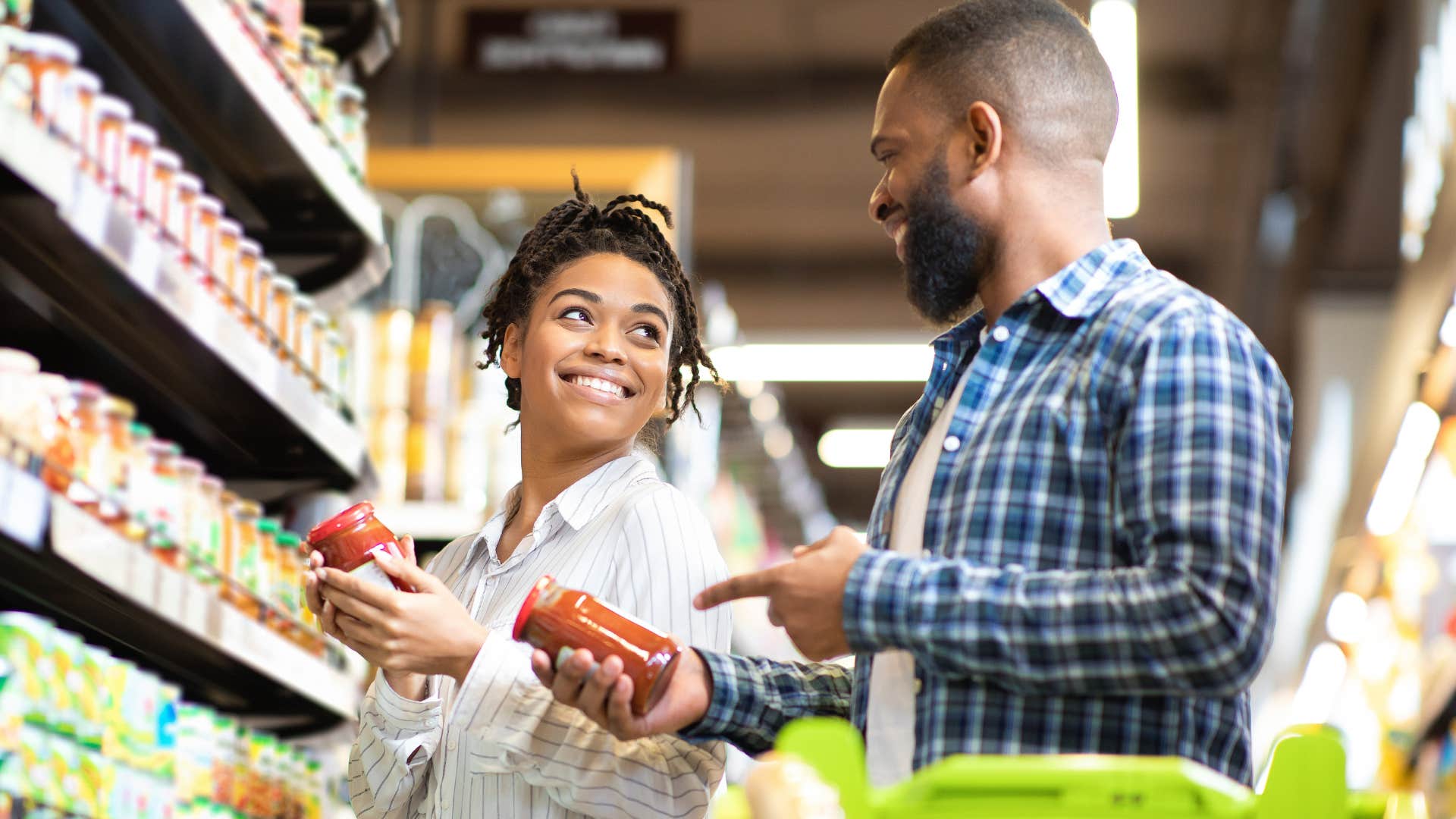 Couple smiling and buying pantry staples in bulk.