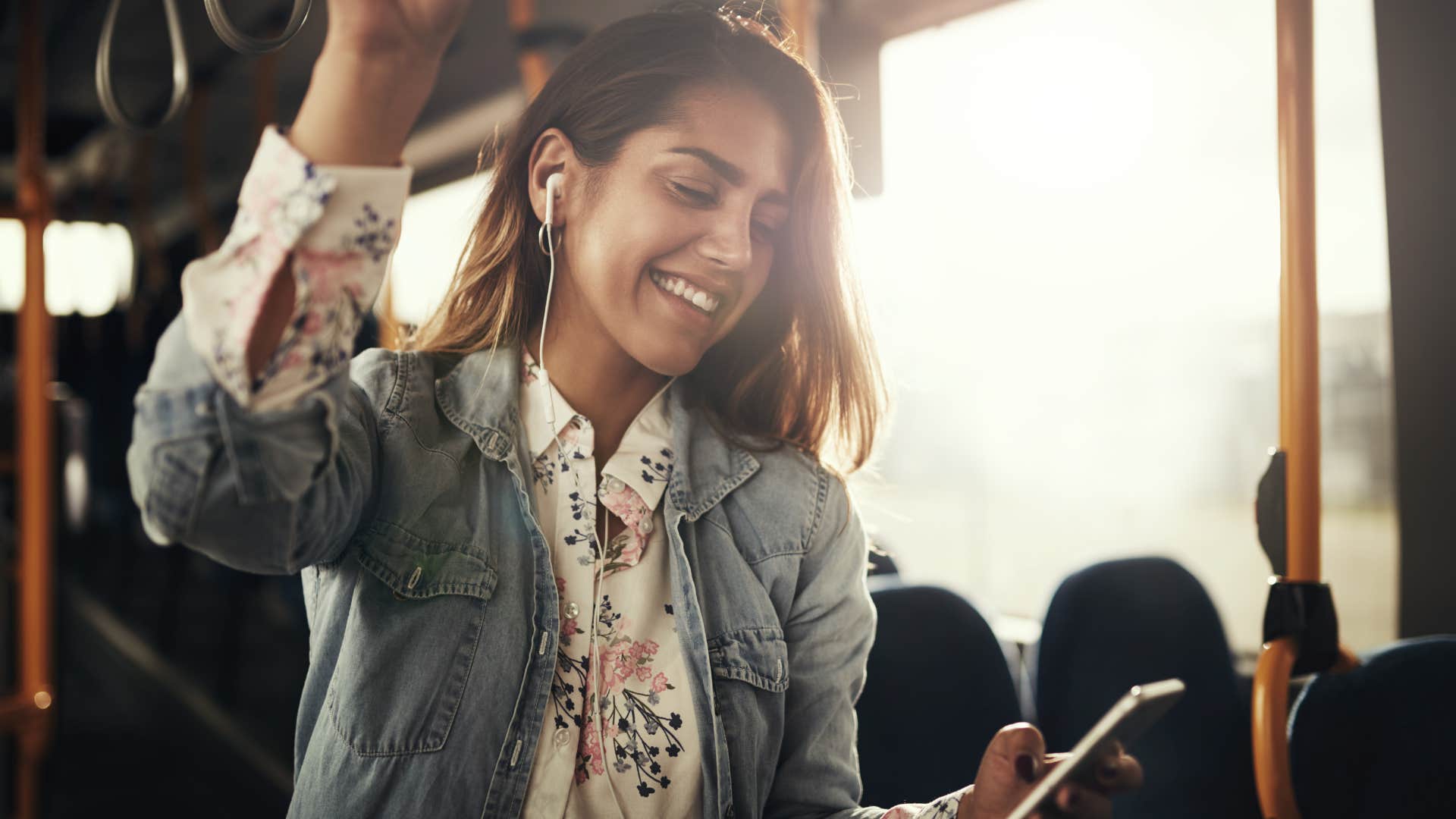 woman who prioritizes a cost-effective commute riding the bus