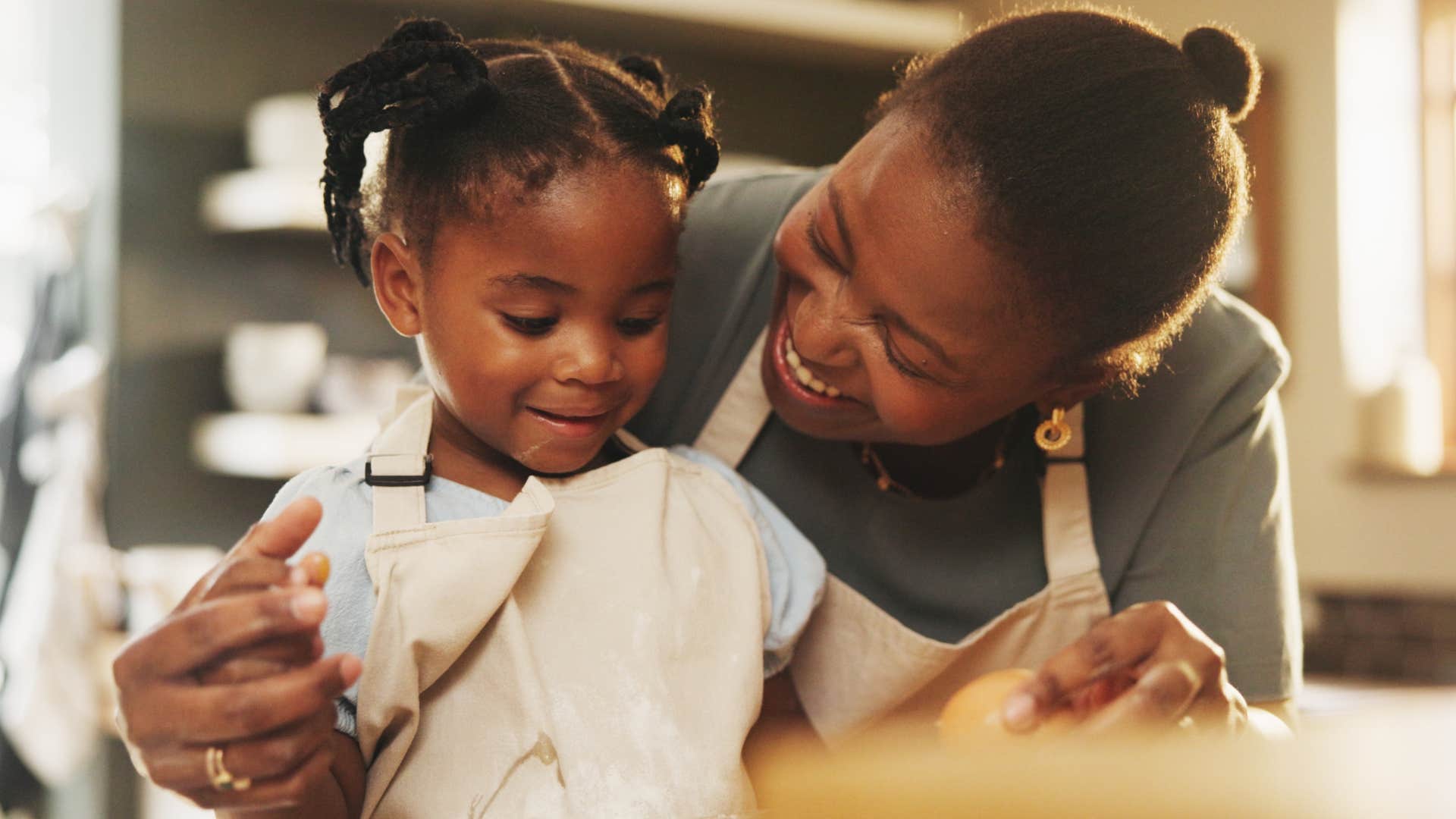 woman having breakfast at home with her daughter