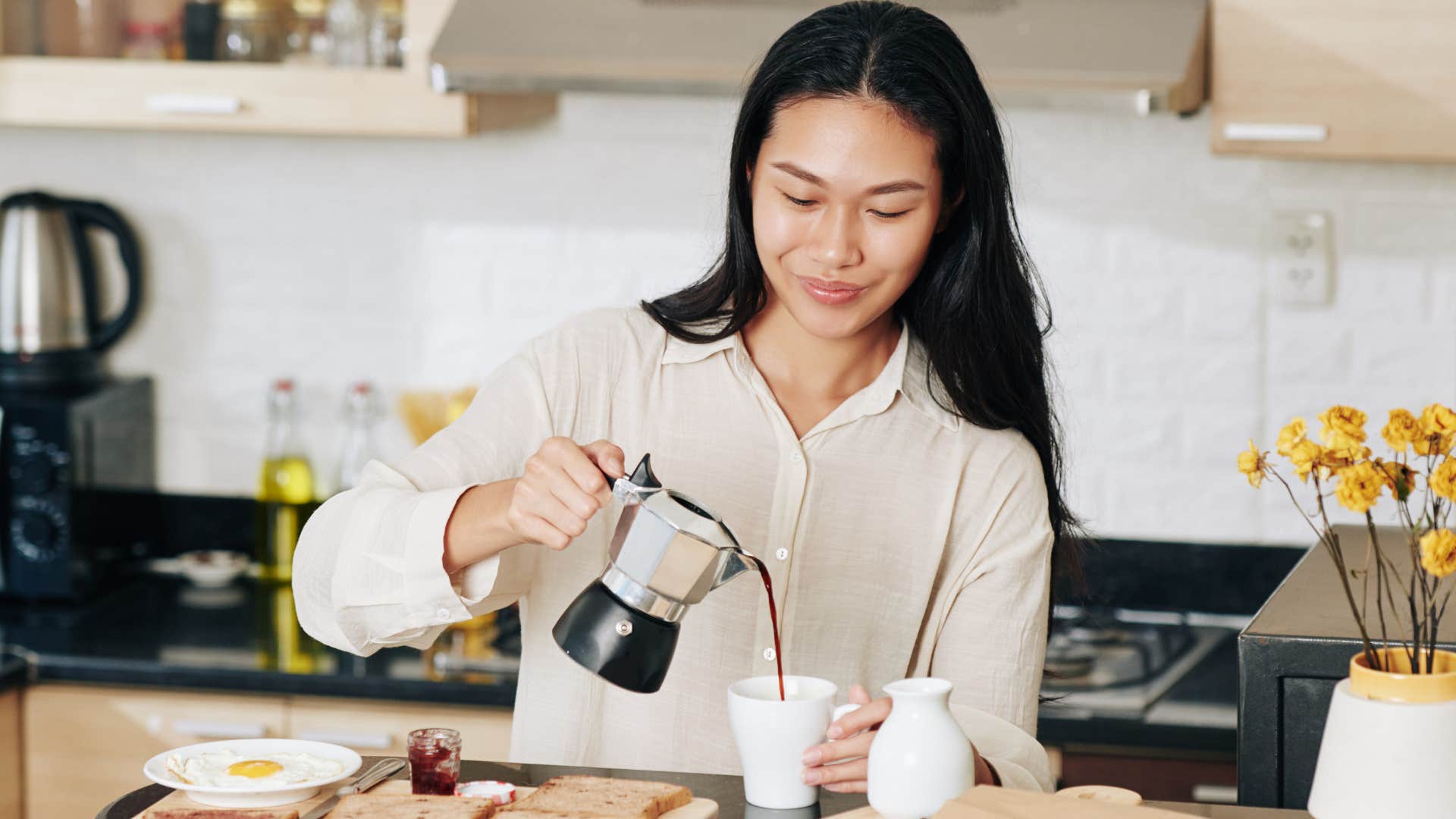 frugal woman brewing coffee in the morning