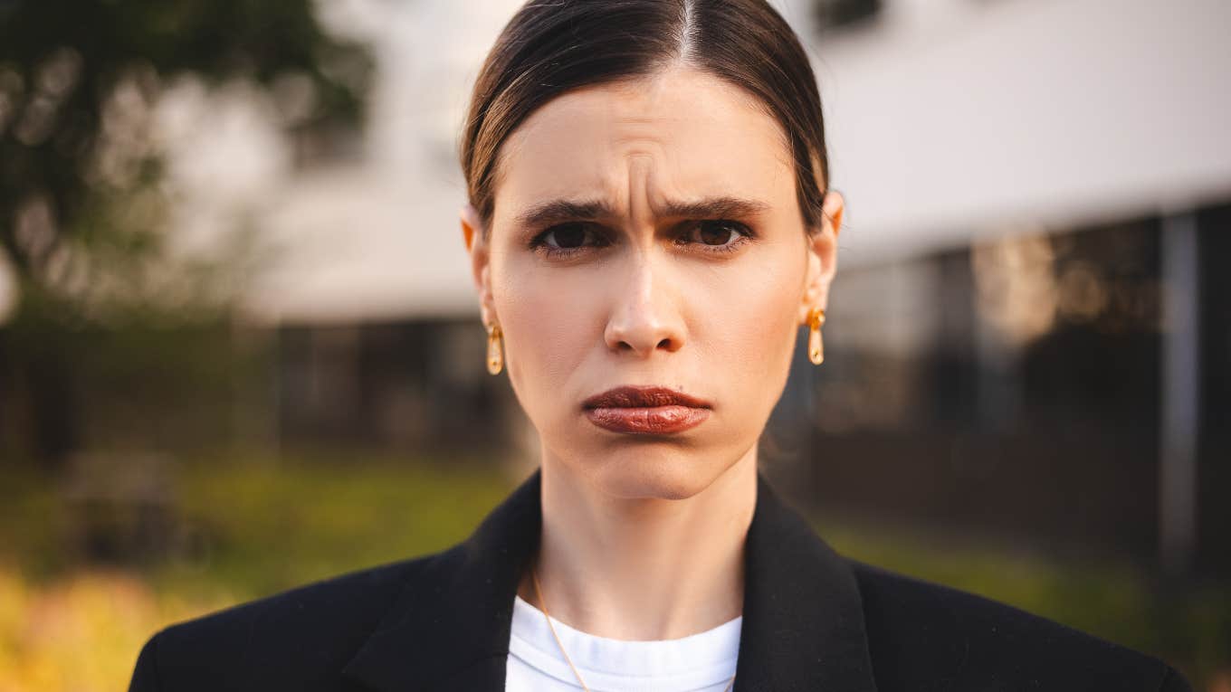 Little Things Frugal People Do That Make Other People Weirdly Defensive woman looking defensive and angry