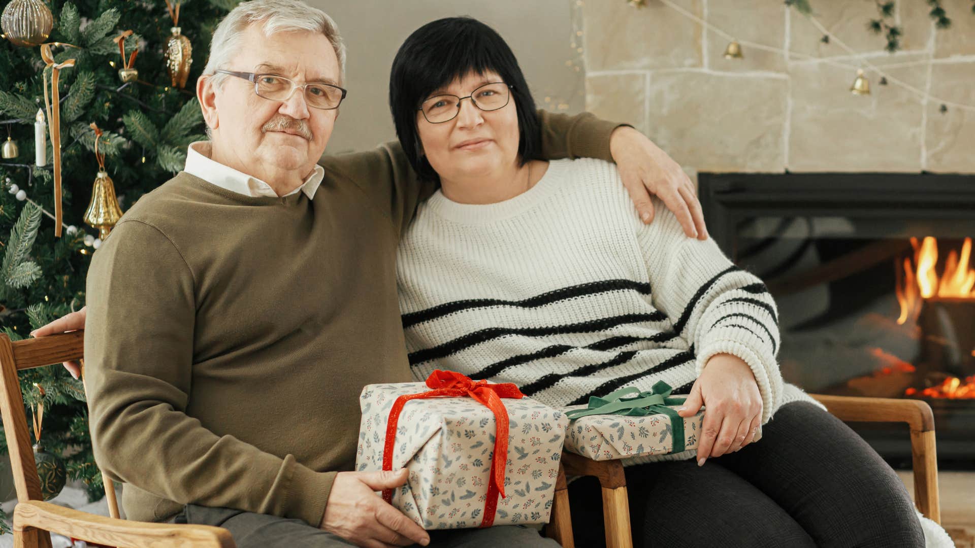 couple giving practical gifts to each other at home