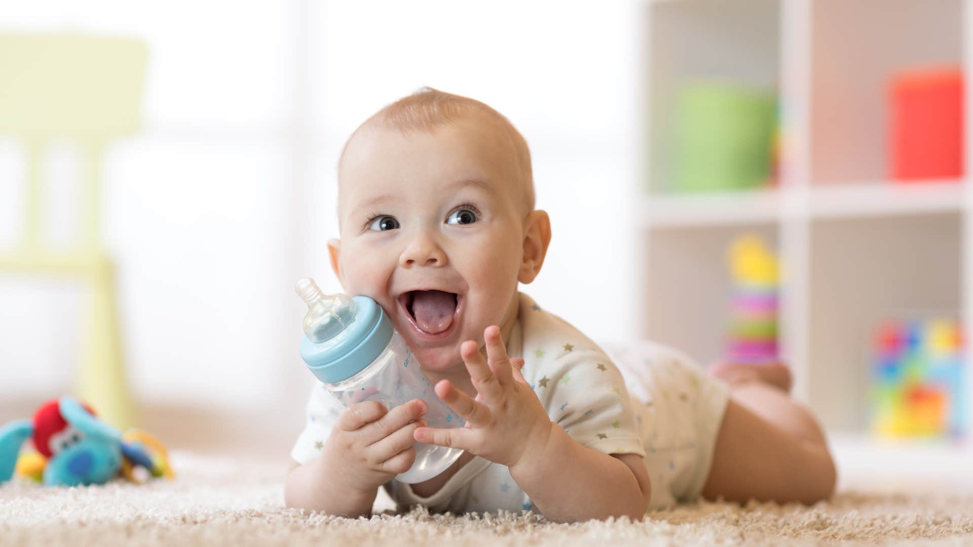 an infants parents give him a reusable bottle with water in it