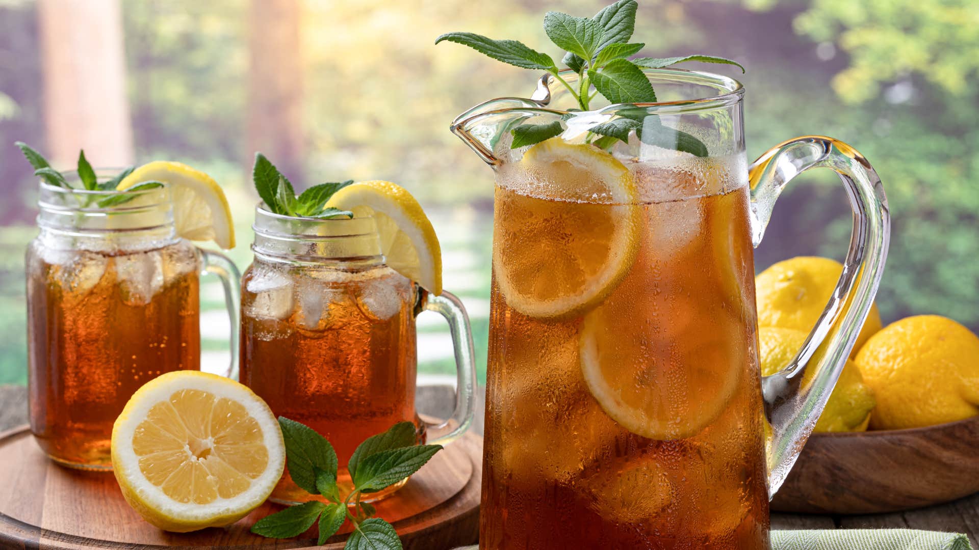 a pitcher of sweet tea with lemon and mint