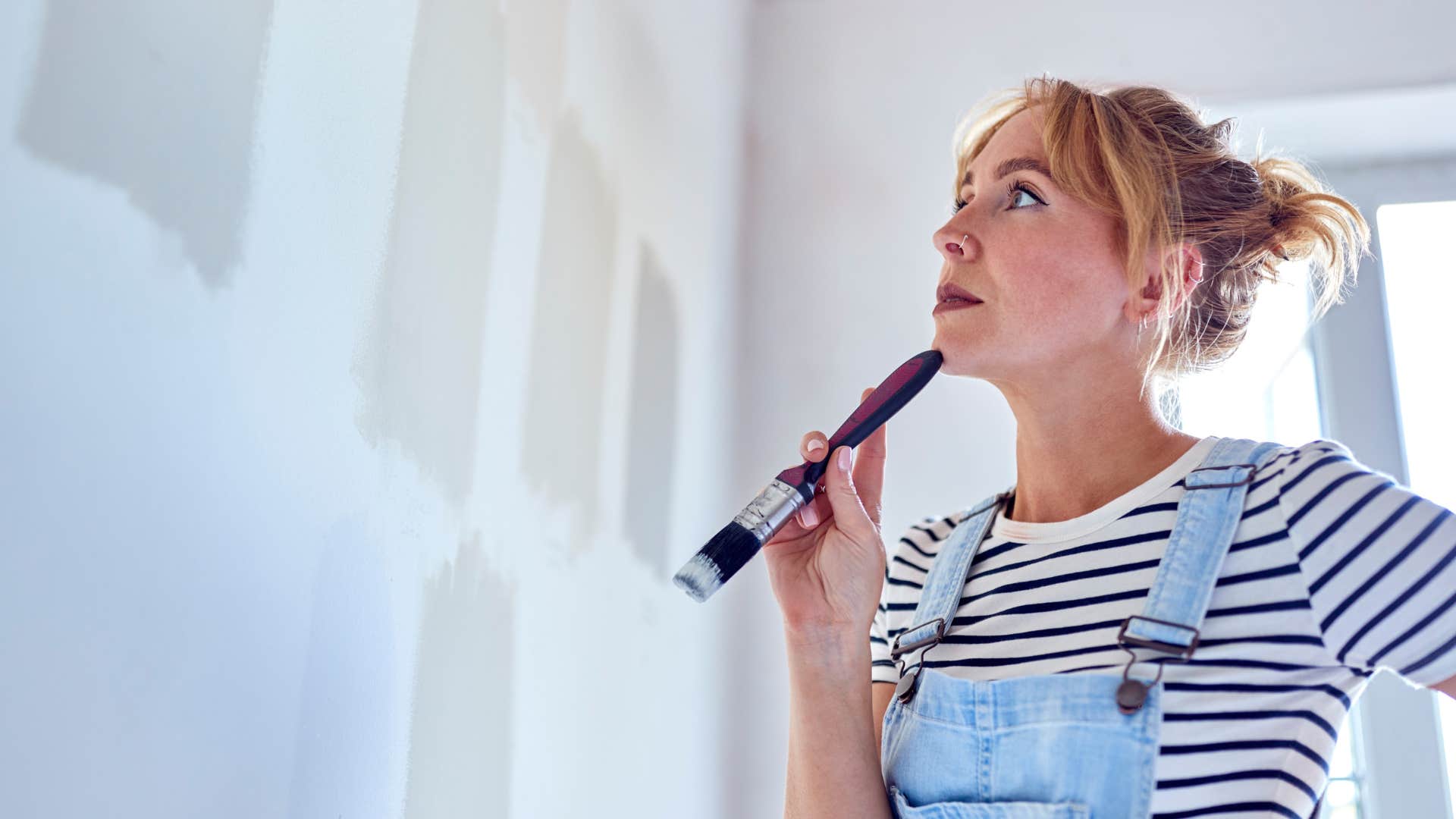 a burned out woman still cannot choose what color she wants to paint her room