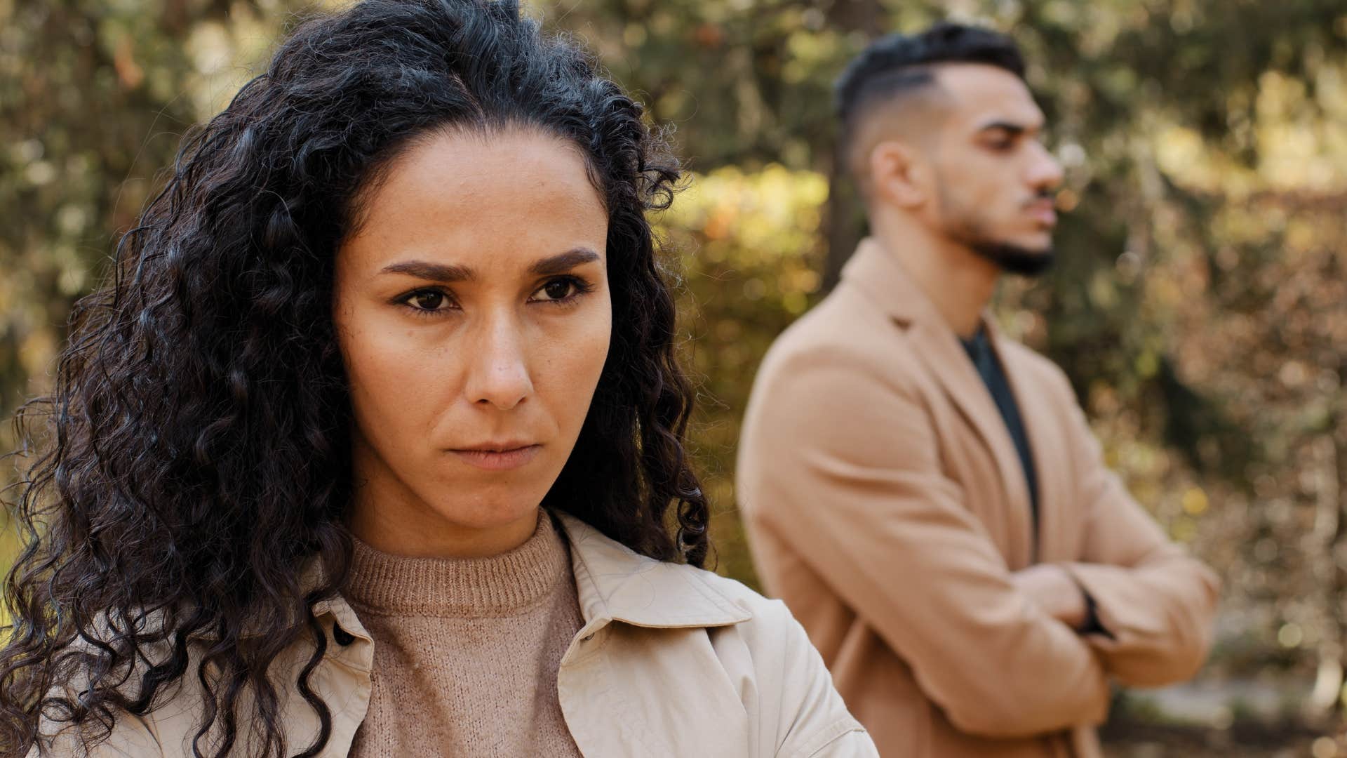 woman avoiding conversation about money in front of her partner