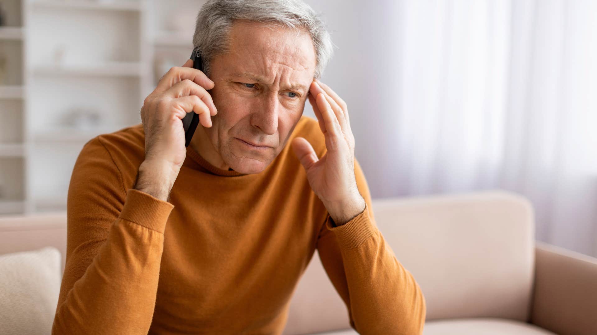 man who never agrees to last-minute plans talking on the phone