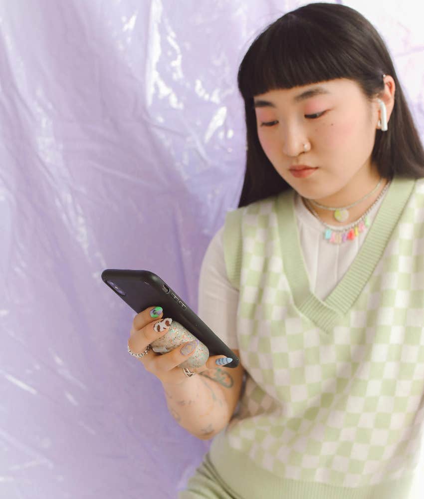 gen z girl on her phone checking social media