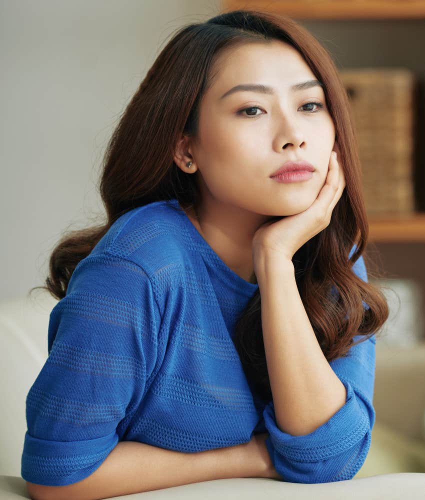Exhausted woman feeling masquerading as love but is a trauma bond 