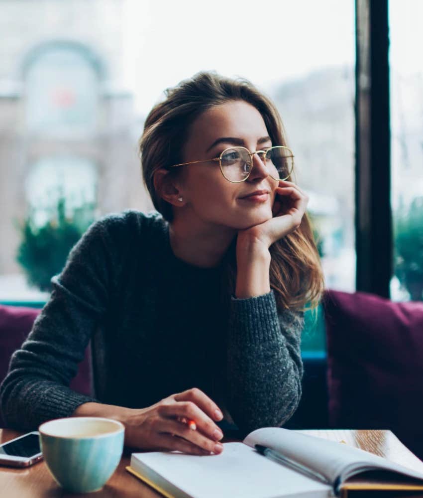 Woman making a list trying manifestation when ready to invite abundance into life 