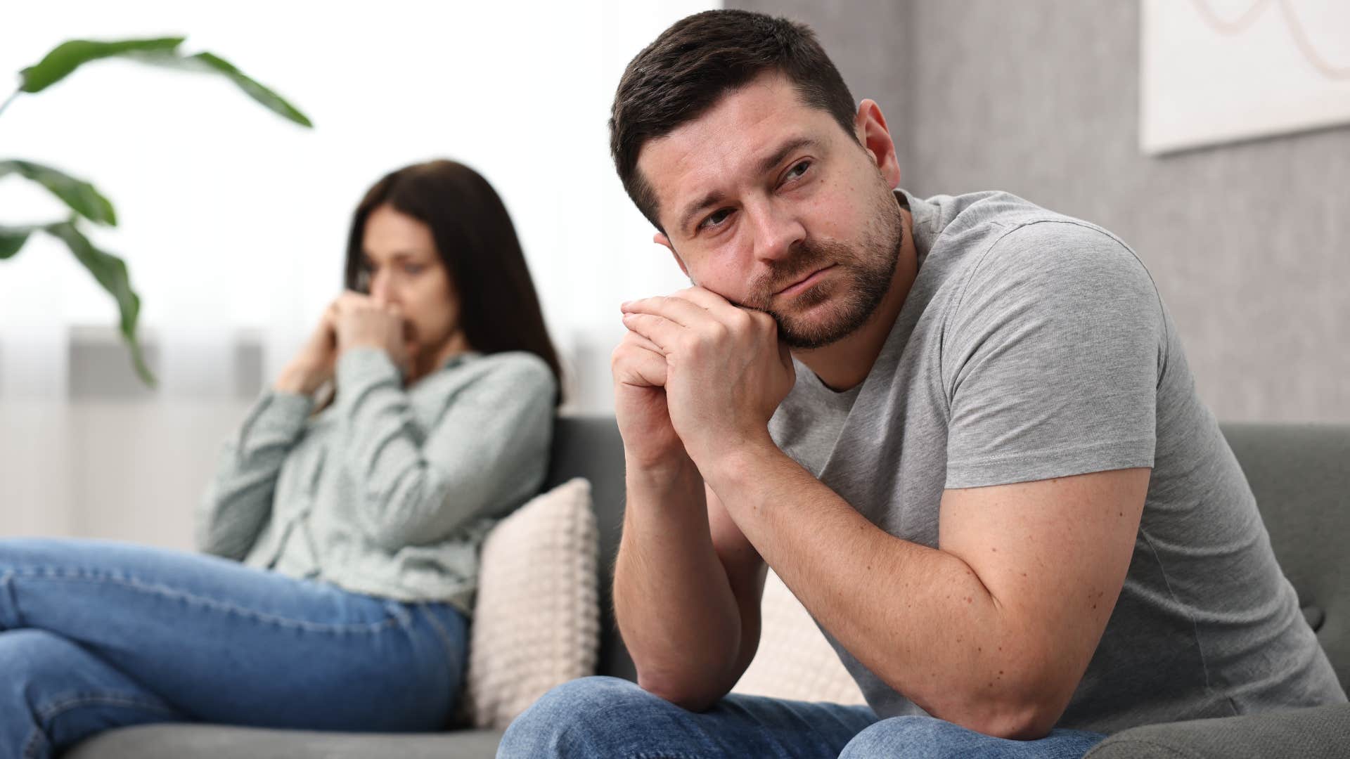Man who feels like a scapegoat turned away from his wife.