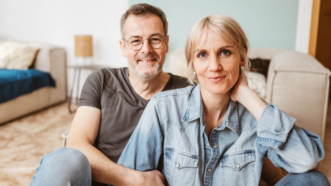 man in love with his wife holding her close