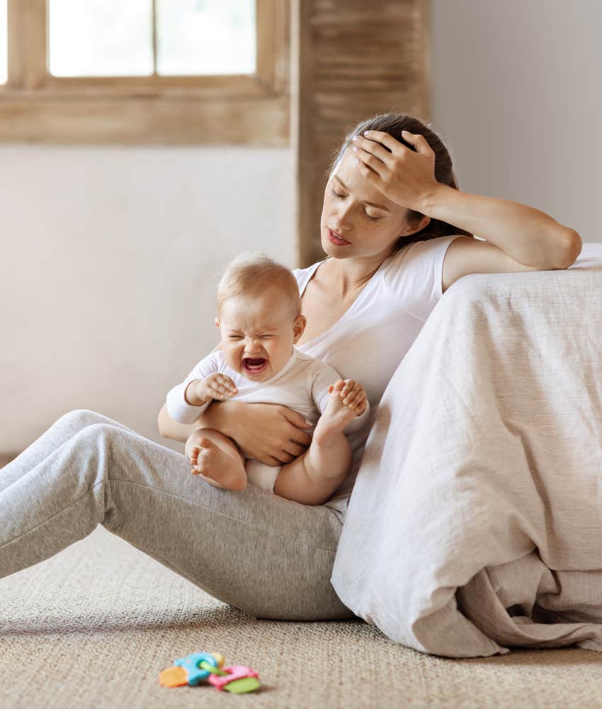 Mom stressed with baby.