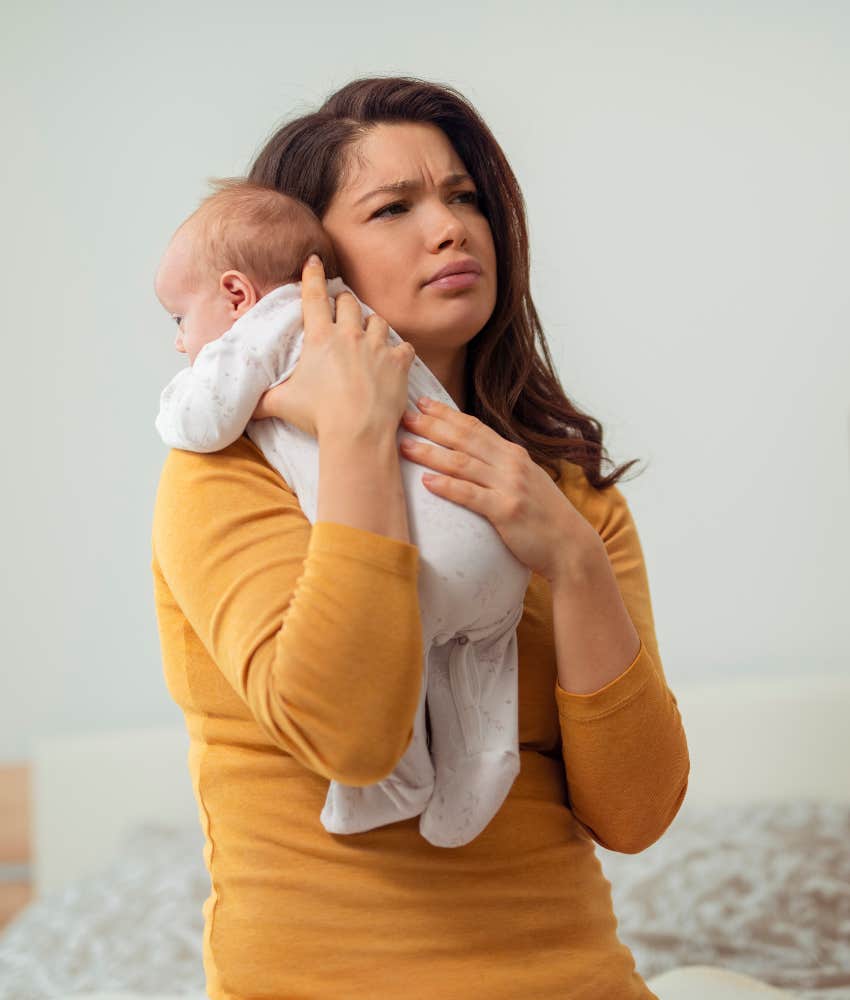 Mom hold baby.