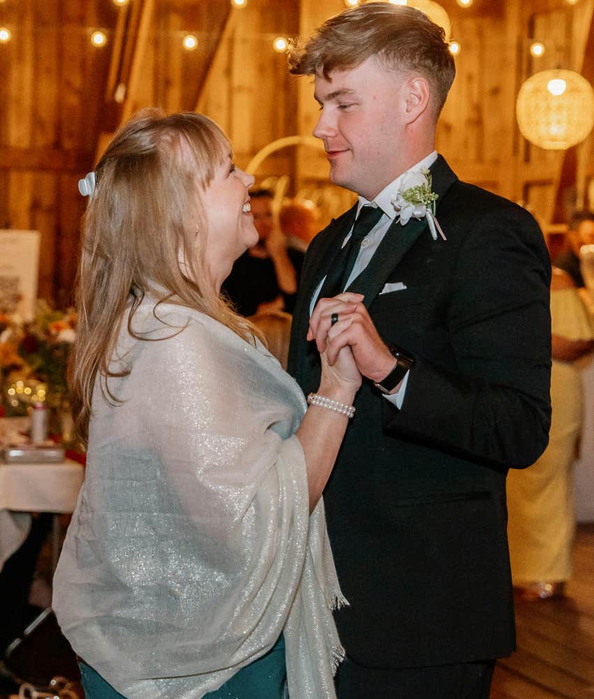 mother of the groom and her son dancing at wedding reception