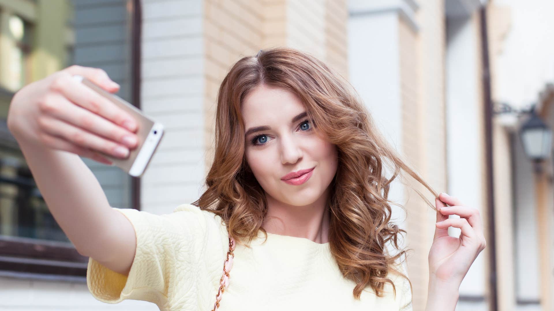 woman taking a staged picture