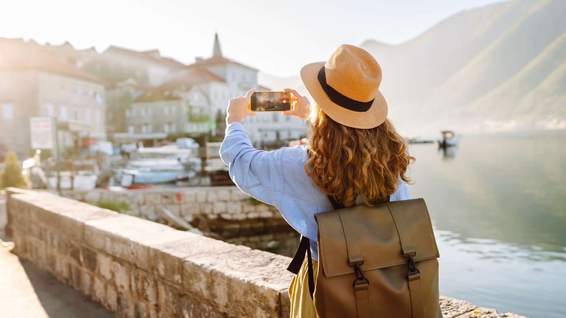 woman taking a picture on vacation