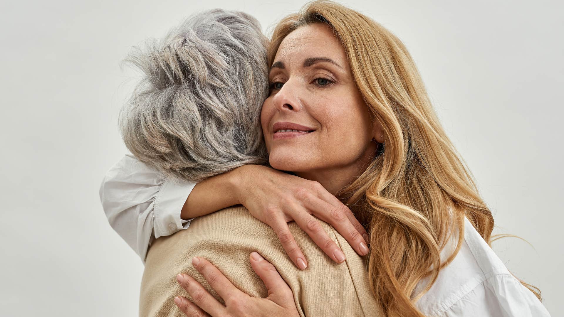 Woman hugging her mom because they're predictable.