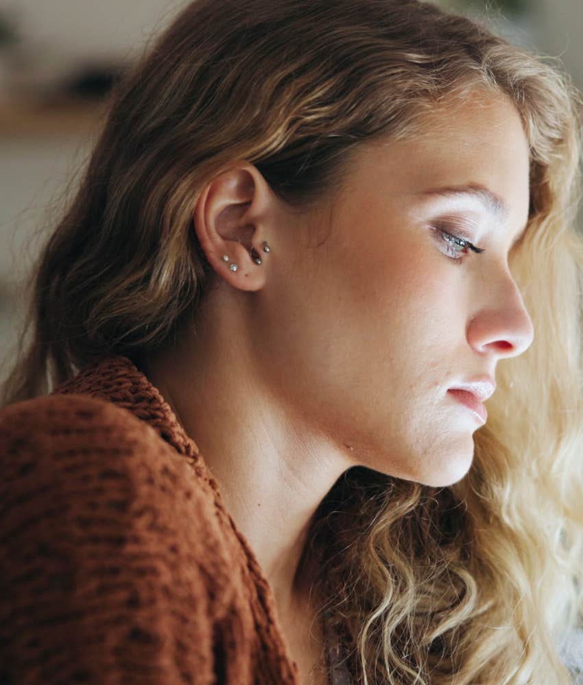 Woman looks sad.
