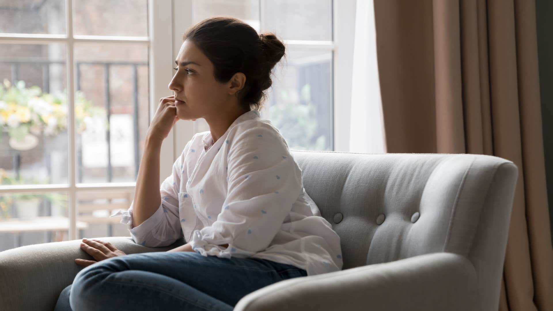 woman in white shirt understanding that silence is power as she reflects