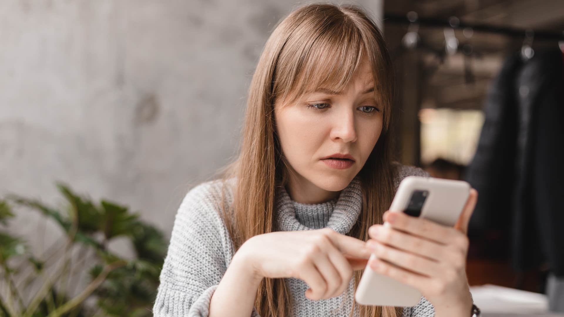 financially irresponsible woman checking her bank balance