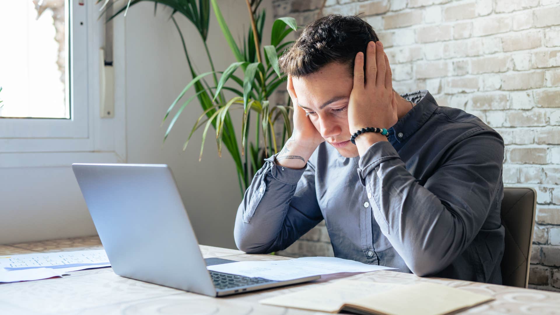 man feeling overwhelmed with financial stress
