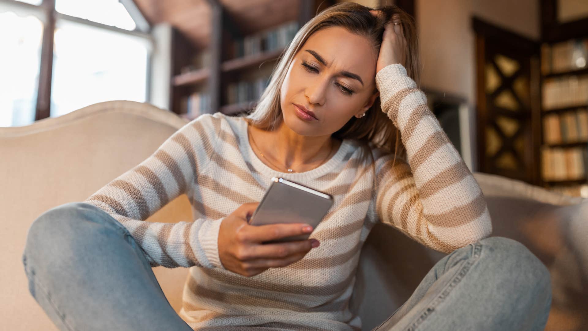woman texting I'm just tired on her phone