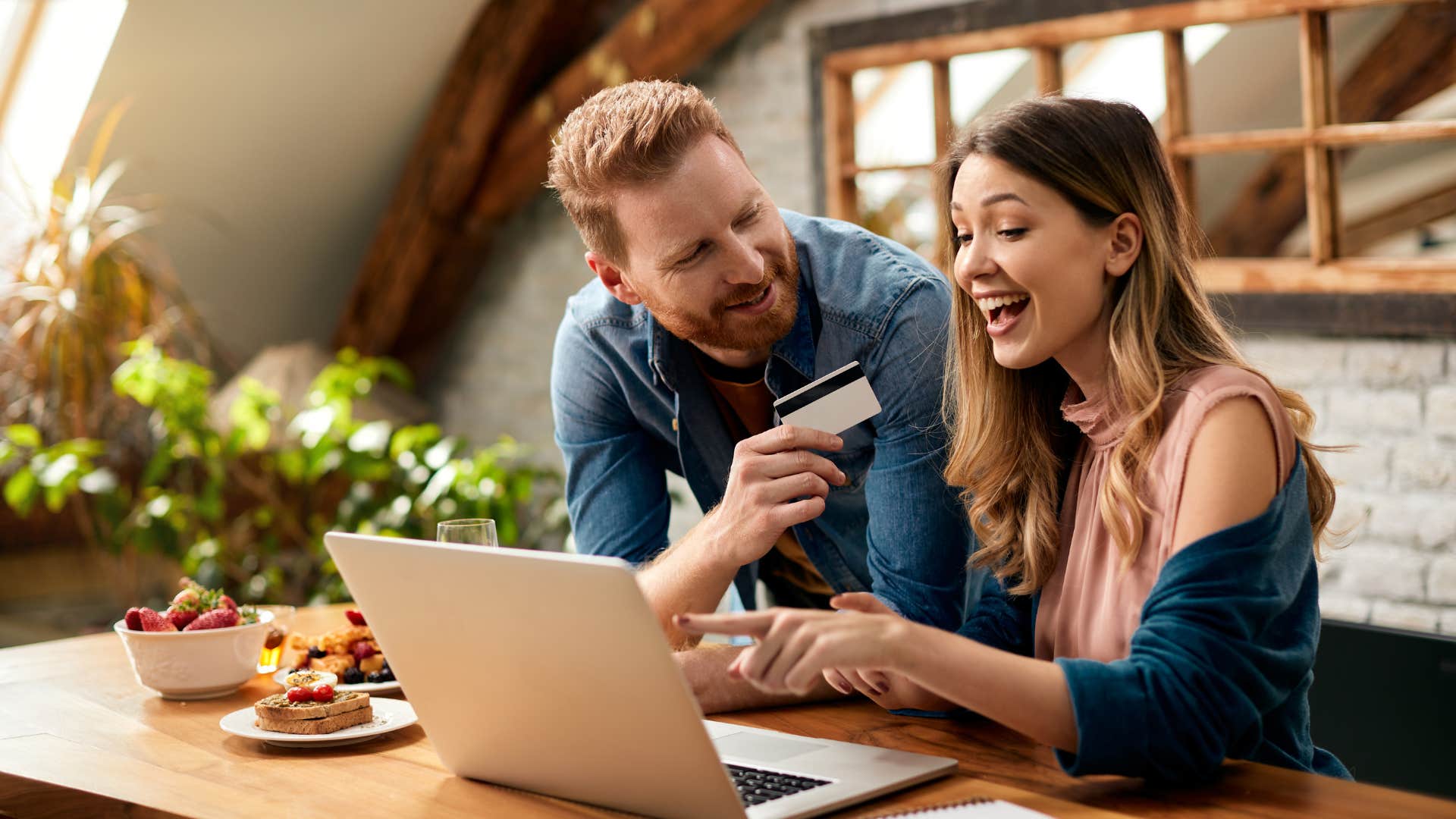 couple using credit card to buy something online