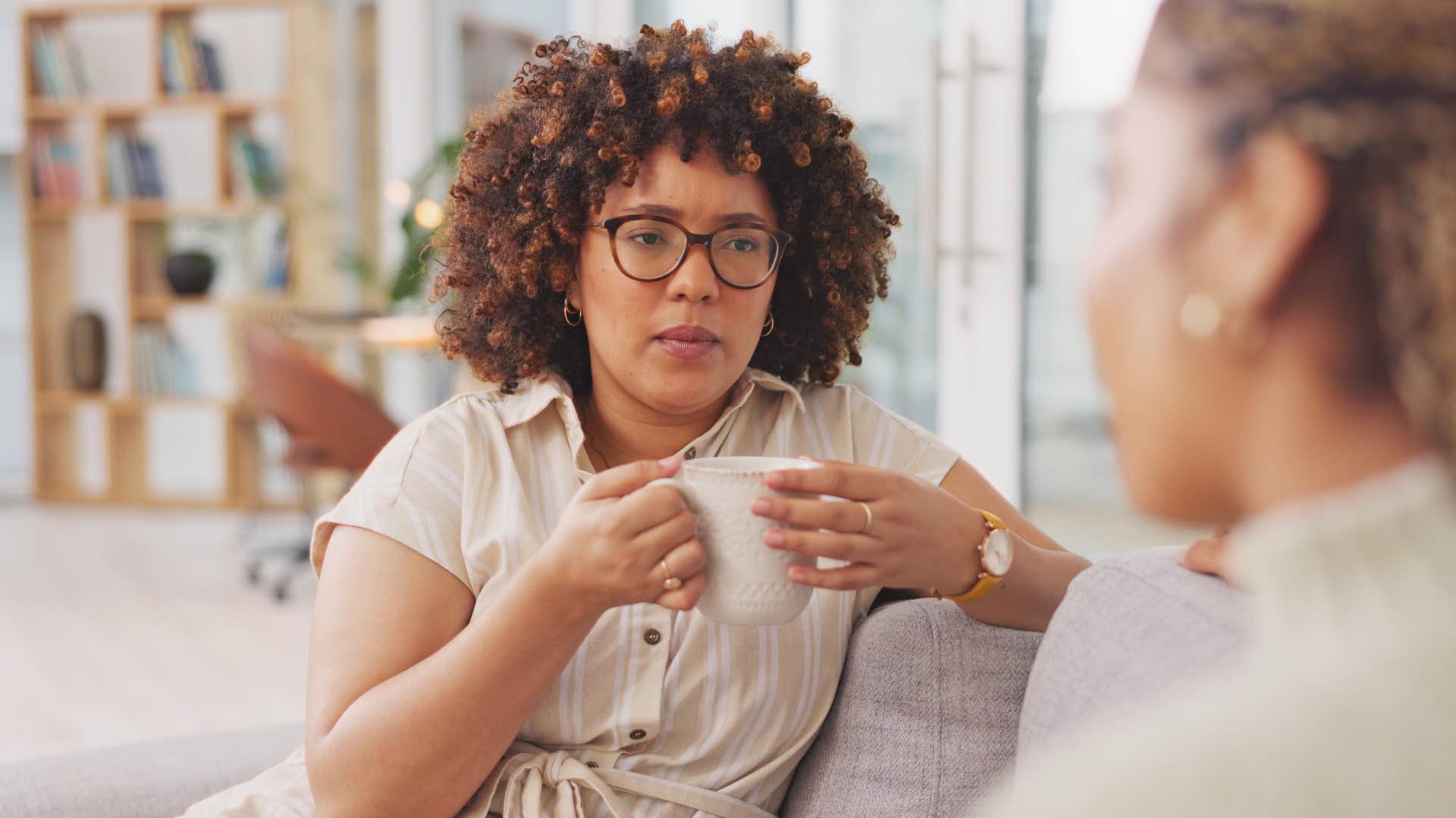 woman listening to family member talking about trauma