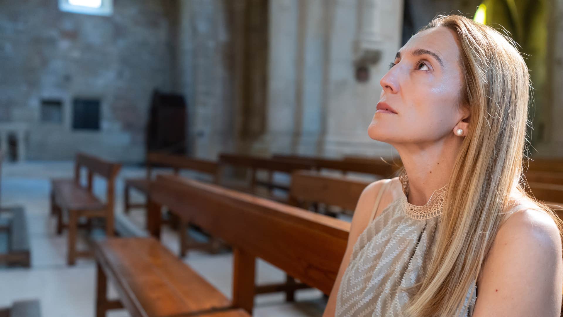 woman who is more youthful than peers sitting in silence
