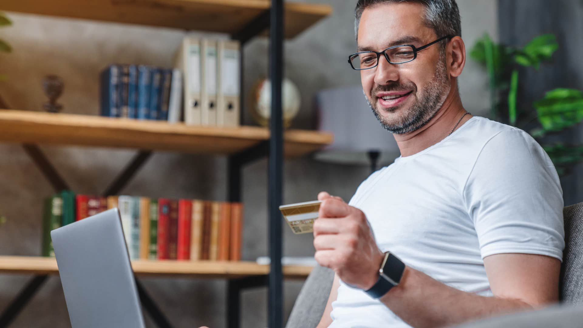 man spending using credit card
