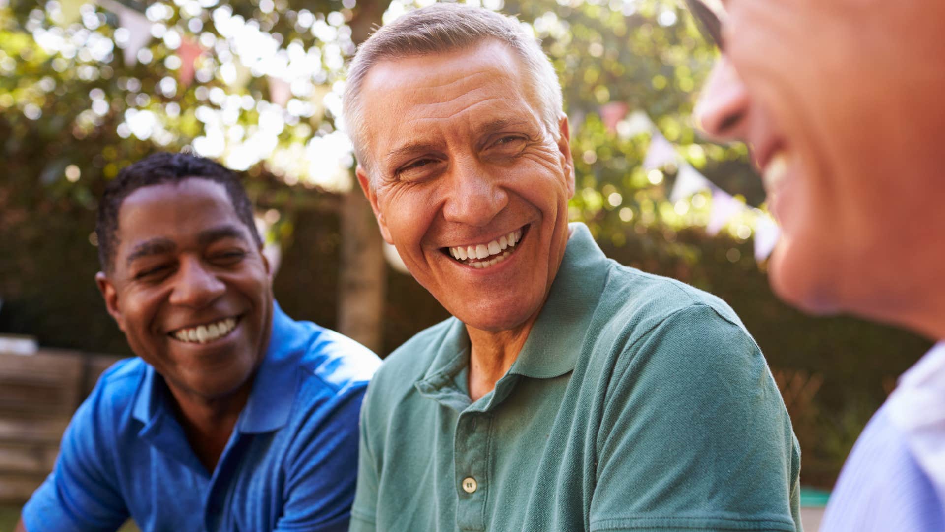 Man who has their communities smiling with friends.