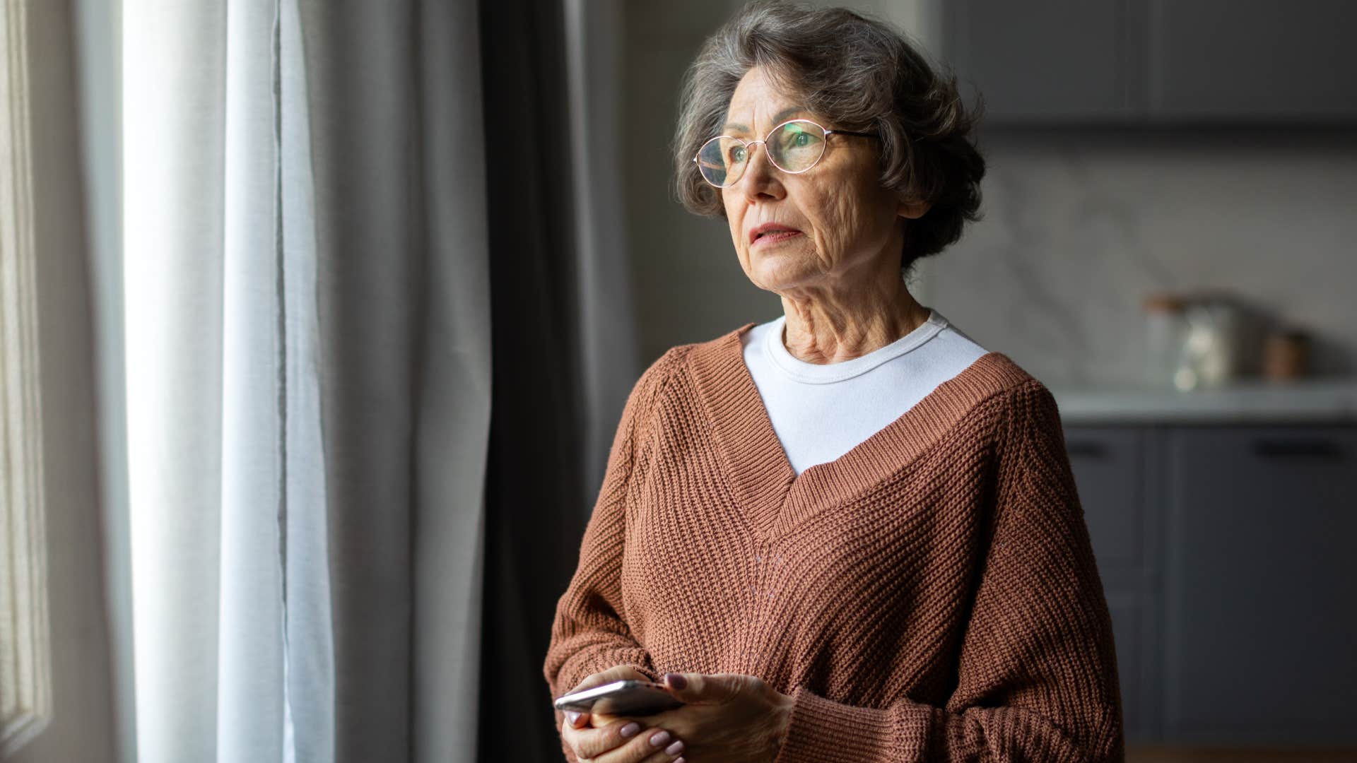an older woman is neglected by her children and grandchildren