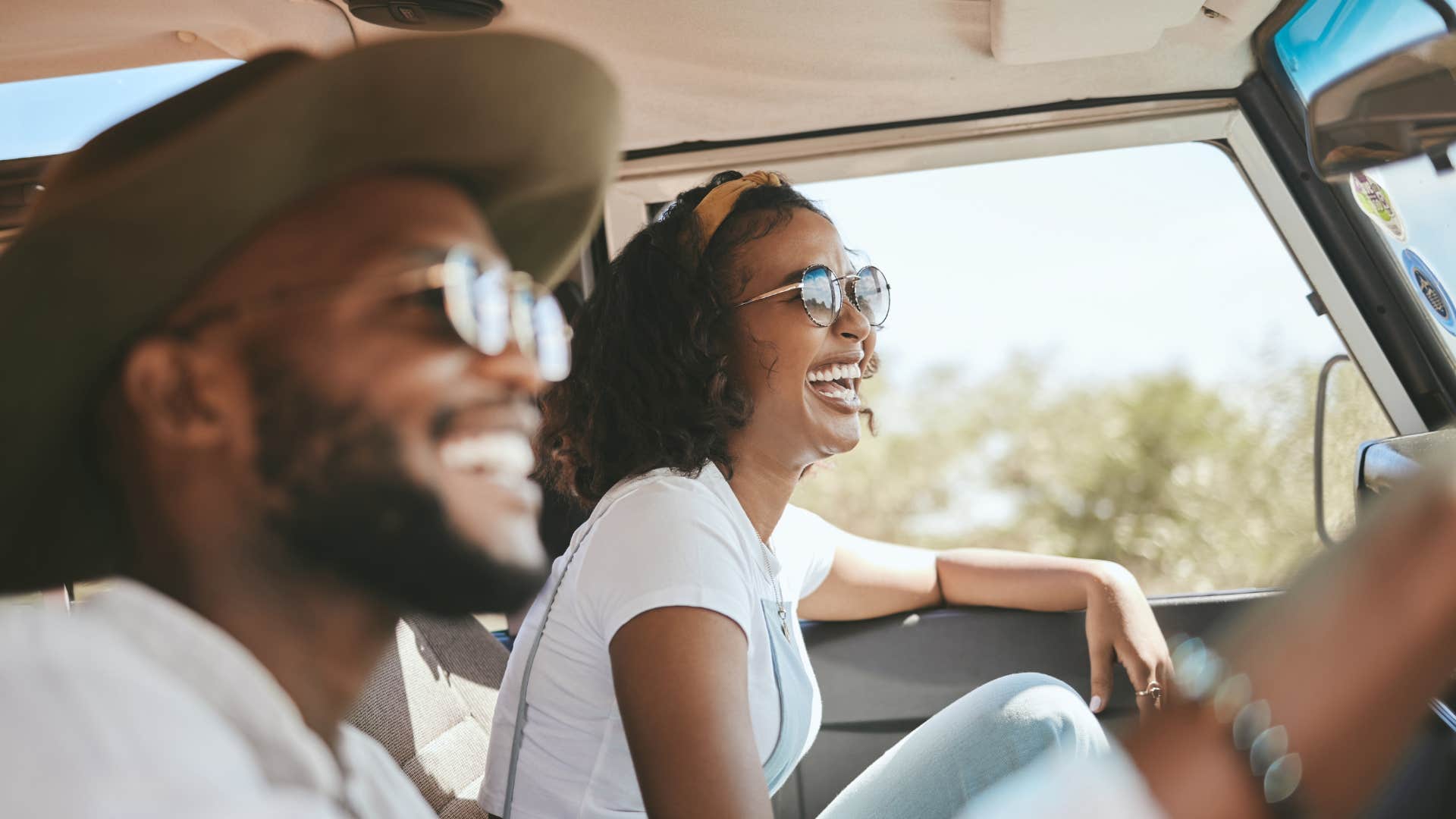 a high iq couple use their sunglasses to protect themselves from the sun