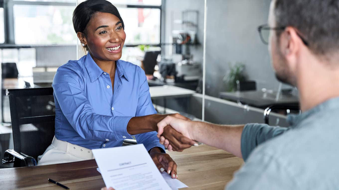 employee shaking hiring managers hand