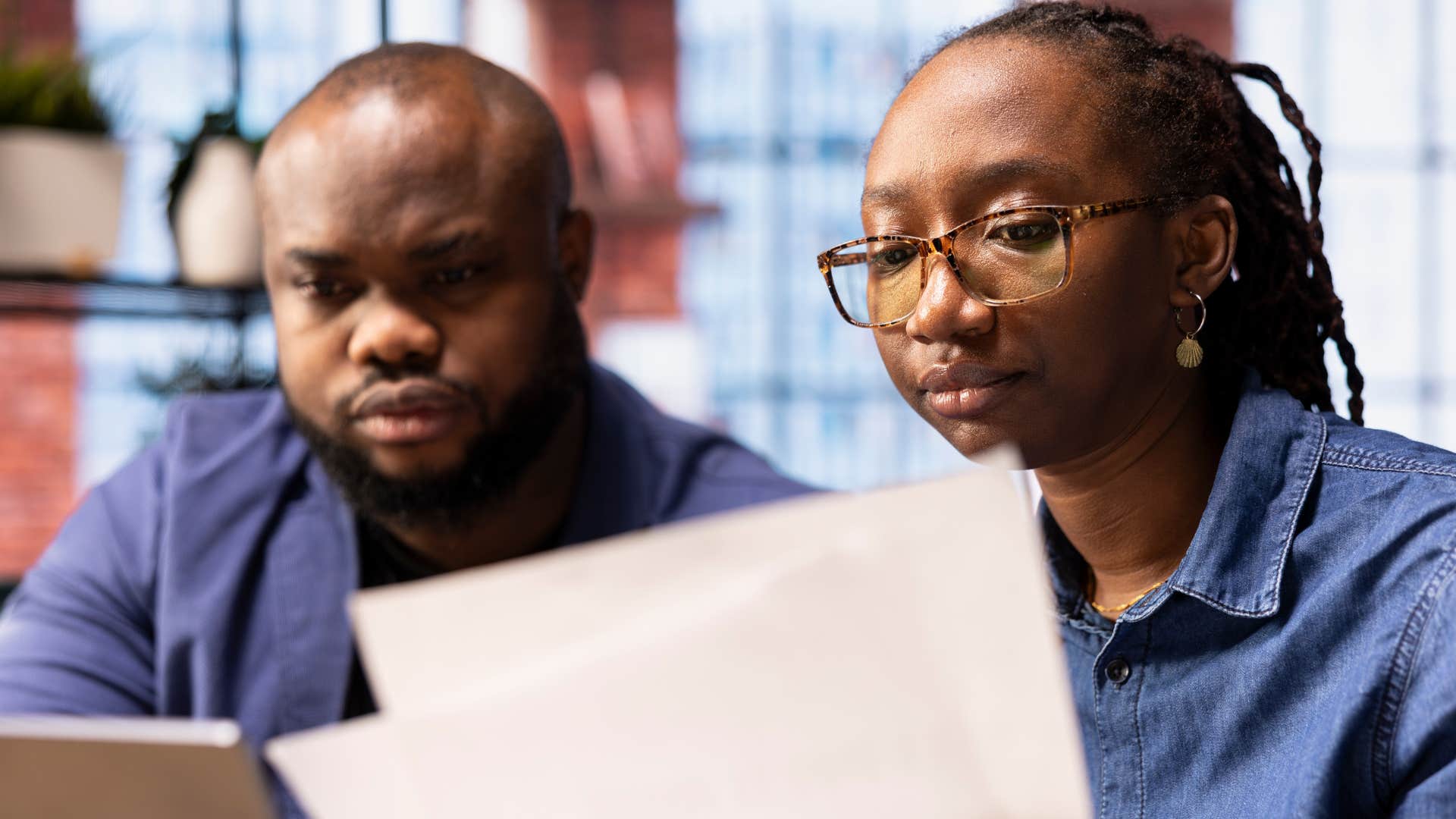Couple looking at a shared calendar at home.